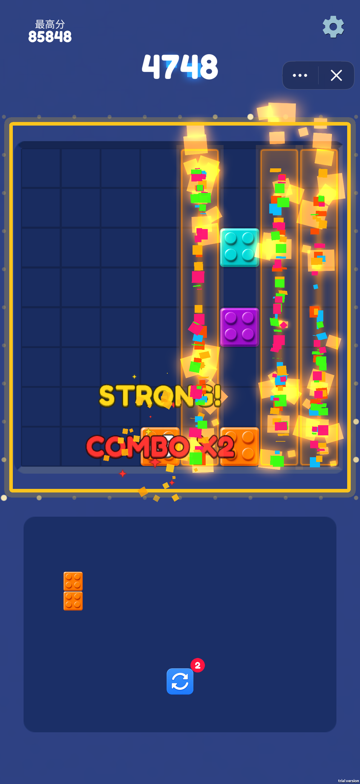 Several vertical columns glow during a clearing effect at score 4748, with STRONG! and COMBO x2 feedback. The highlighted columns show the spaces opened by the clear. An orange two-cell bar remains below.